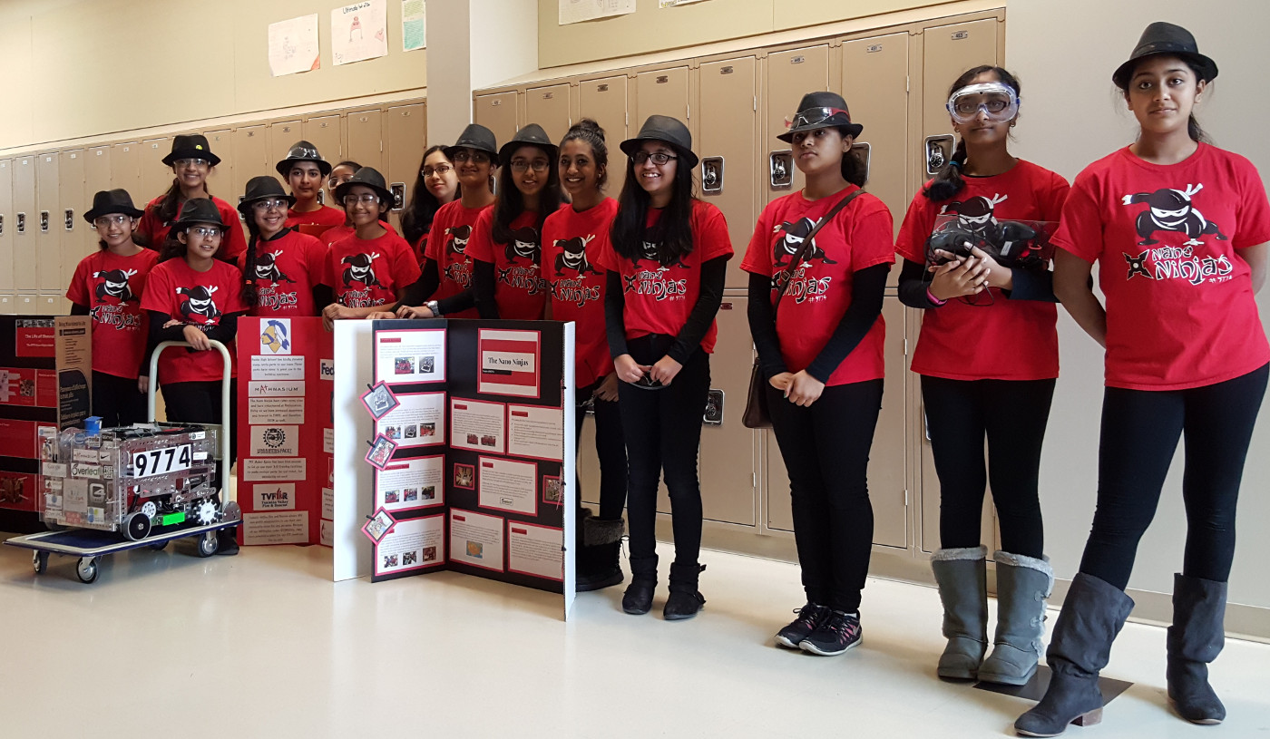 The Nano Ninjas team with their robot and display!