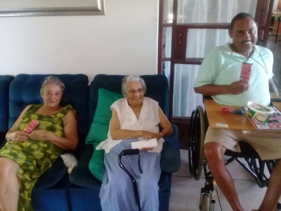 Genasys handing out slabs of chocolates to the residents of the local Old Aged Home for Valentine's Day 