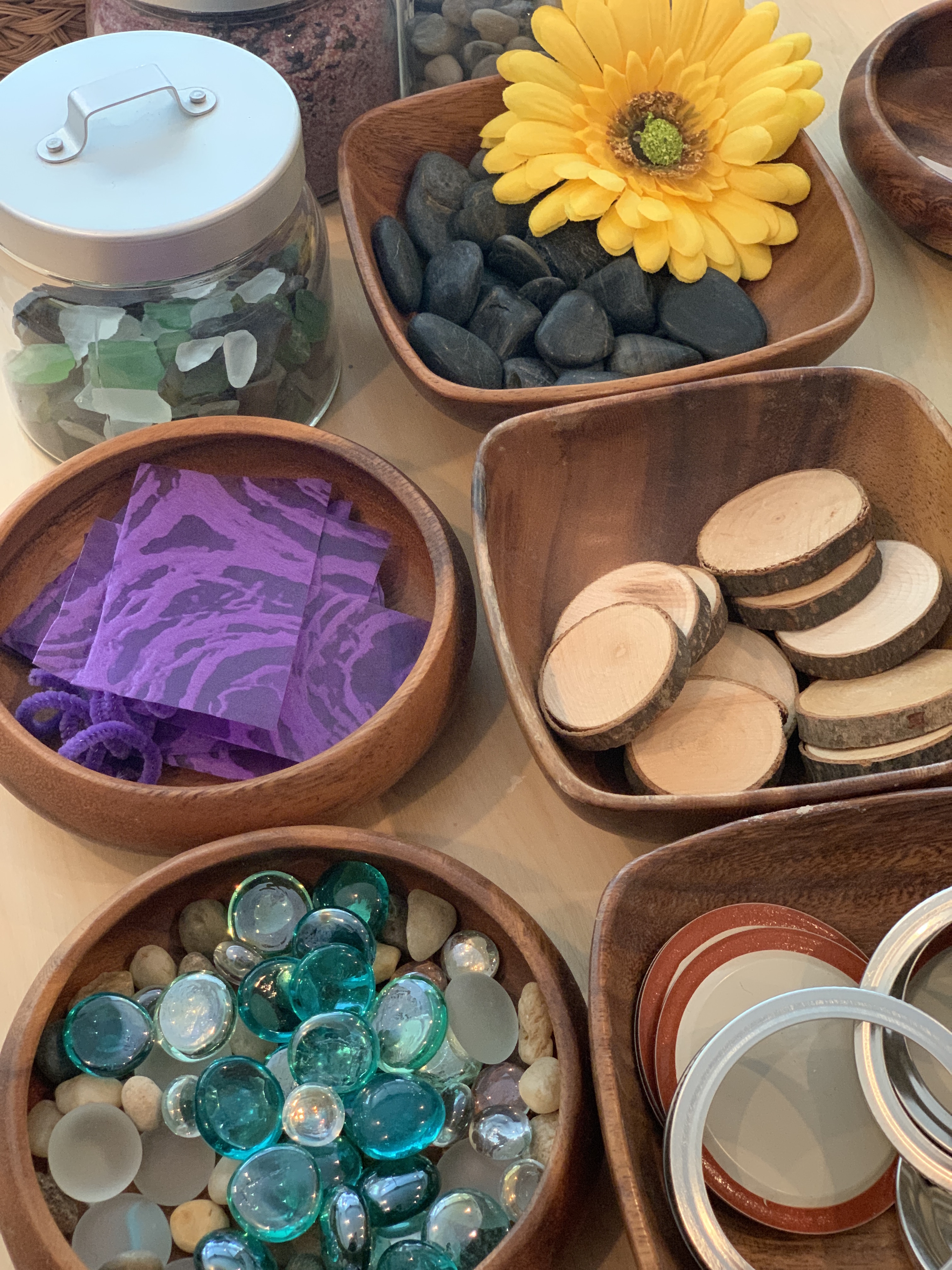 loose parts sorted in bowls