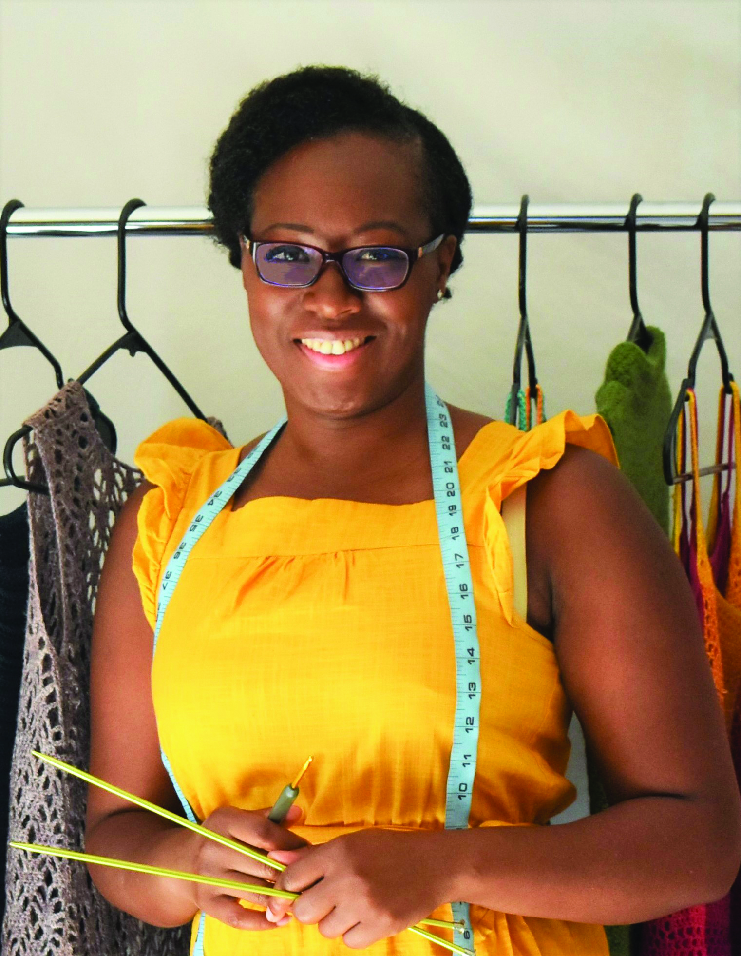 designer lady with knitting needles and hooks