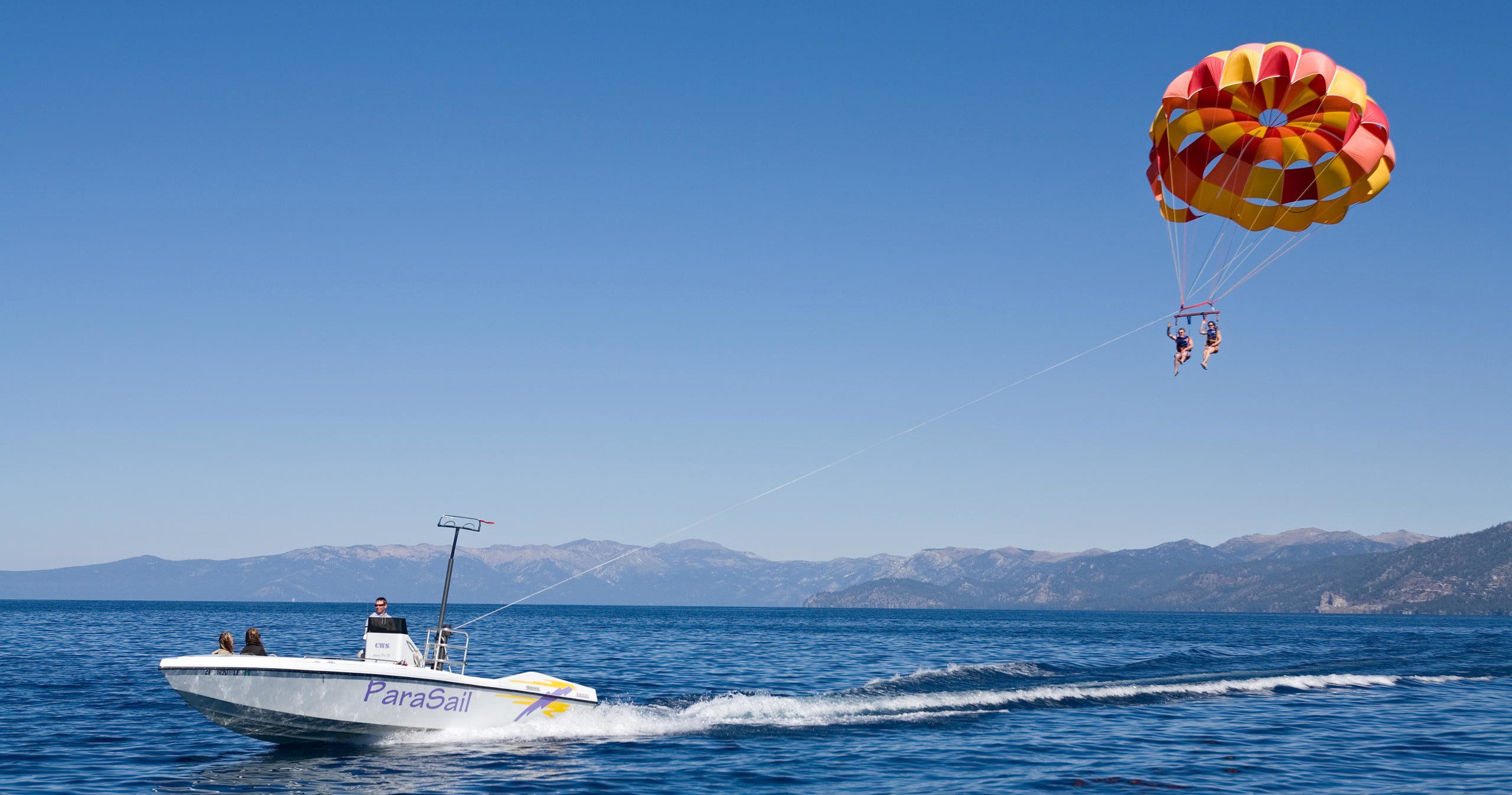 Experience the thrill of parasailing over South Lake Tahoe with Timber Cove Marina, where breathtaking views meet adrenaline-pumping adventure. As you soar high above the crystal-clear waters and rugged shoreline, you'll enjoy a unique perspective of the surrounding Sierra Nevada mountains and the sparkling lake below. This private parasailing tour offers personalized attention, friendly guides, and a safe, exhilarating experience suitable for first-timers and seasoned flyers alike. Whether you're celebrating a special occasion or simply craving an unforgettable day outdoors, parasailing here provides the perfect blend of serenity and excitement. Capture stunning photographs from the sky, feeling the warm sun and gentle breeze as you glide peacefully across the lake. After your flight, enjoy the scenic beauty of South Lake Tahoe, explore local eateries, or embark on additional outdoor adventures. Timber Cove Marina’s expert team prioritizes safety, making this adventure accessible and enjoyable for all ages. No matter the season, parasailing over Tahoe creates lasting memories and a sense of freedom that keeps visitors coming back year after year. - Reno, Nevada