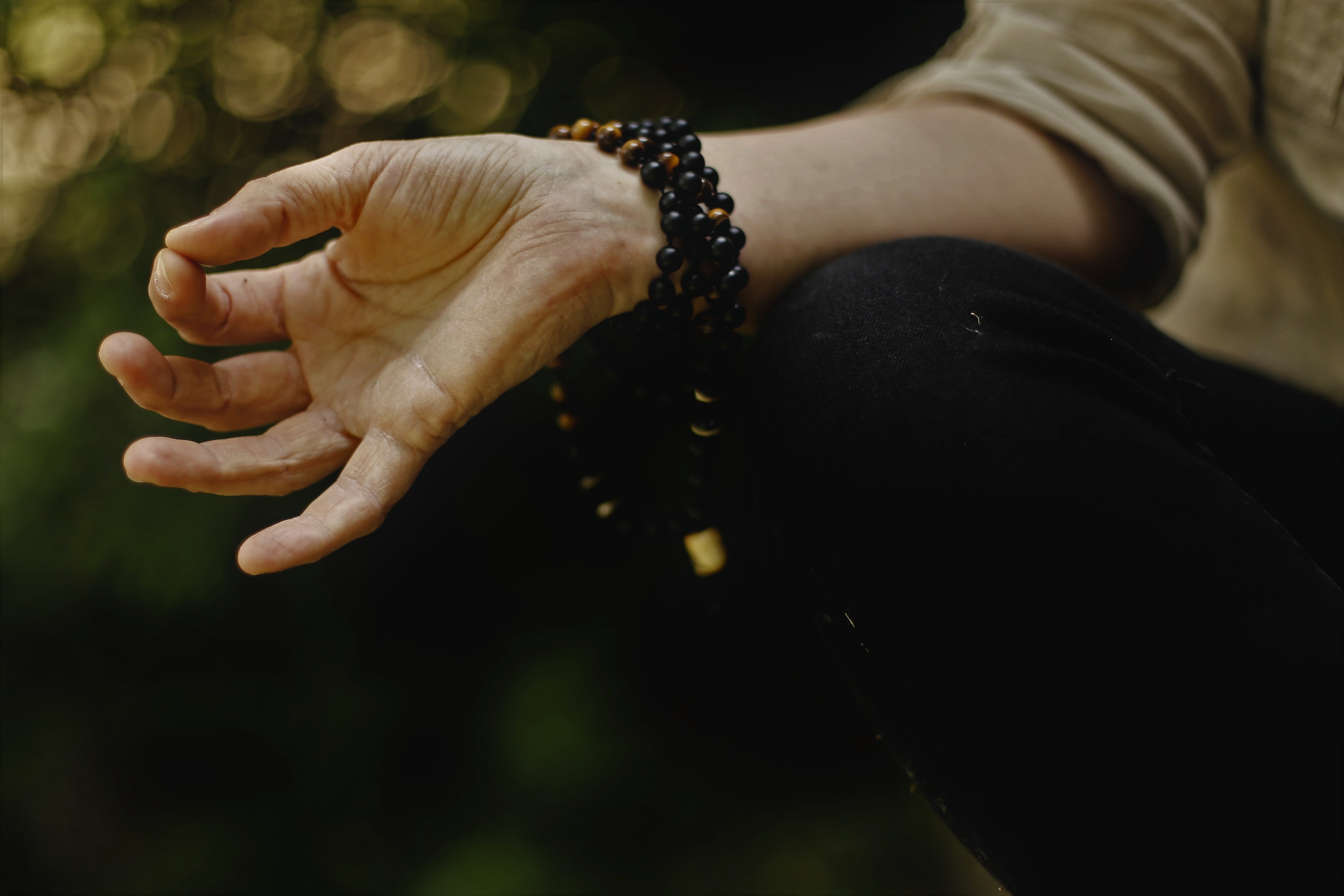 Person meditating hand close up