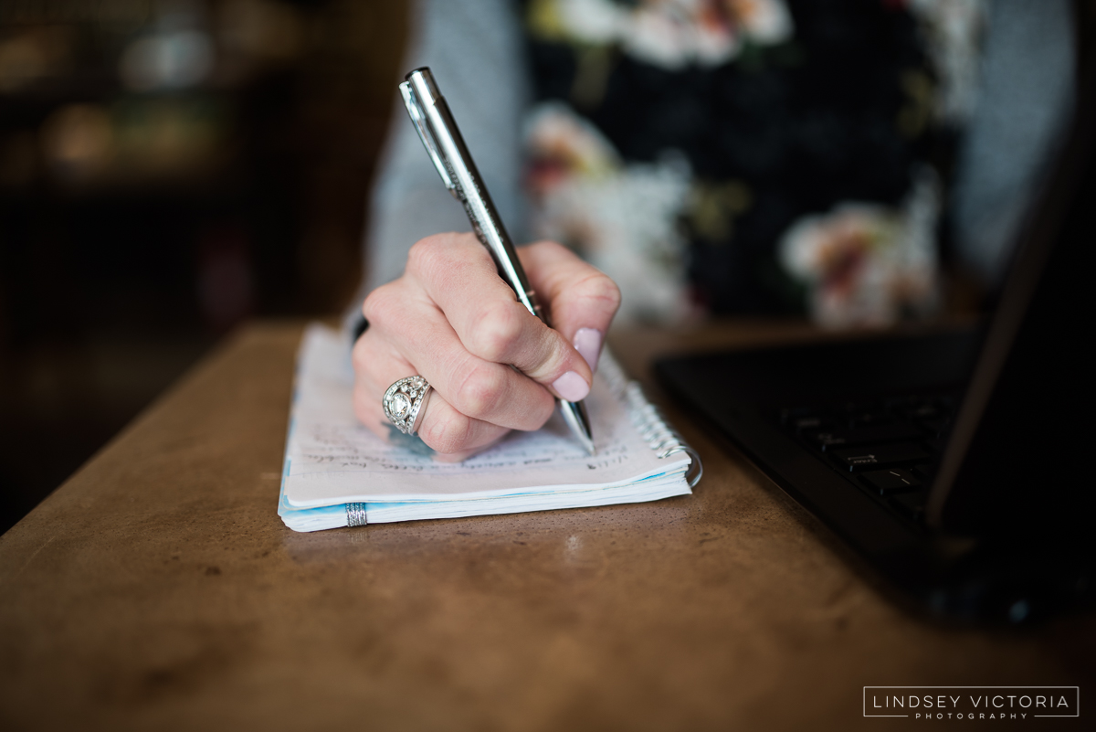 Photo of hand writing in notebook