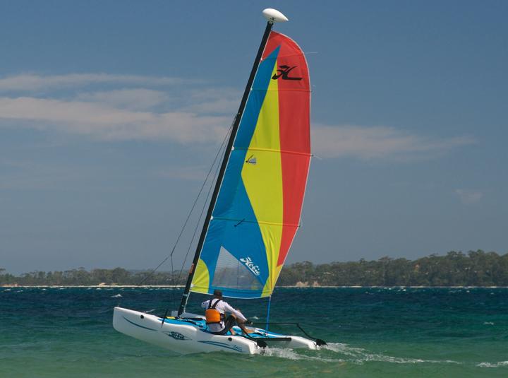 Discover an exhilarating way to experience Sturgeon Bay with the Hobie 14’ Sailboat rental from Door County Boat Rentals. This unique vessel, designed for solo sailors or up to four crew members, combines simplicity with fun thanks to its trampoline deck and drop-down rudder. Ideal for beginners and seasoned sailors alike, the Hobie Wave offers an accessible introduction to sailing or a refreshing day on the water. Glide across the inviting waters of Lake Michigan and the bay while enjoying stunning scenery that only Door County can provide. Whether you’re seeking thrilling wind-powered speed or a relaxing paddle with close friends, this sailboat adapts to your style. Door County’s clear, often calm waters make it a perfect playground for this compact, lightweight craft. After your adventure, explore nearby waterfront dining and charming local shops for a complete day trip experience. Whether you’re making memories with family or embracing a solo escape, sailing the Hobie 14’ in Sturgeon Bay offers an unforgettable outdoor adventure. - Green Bay