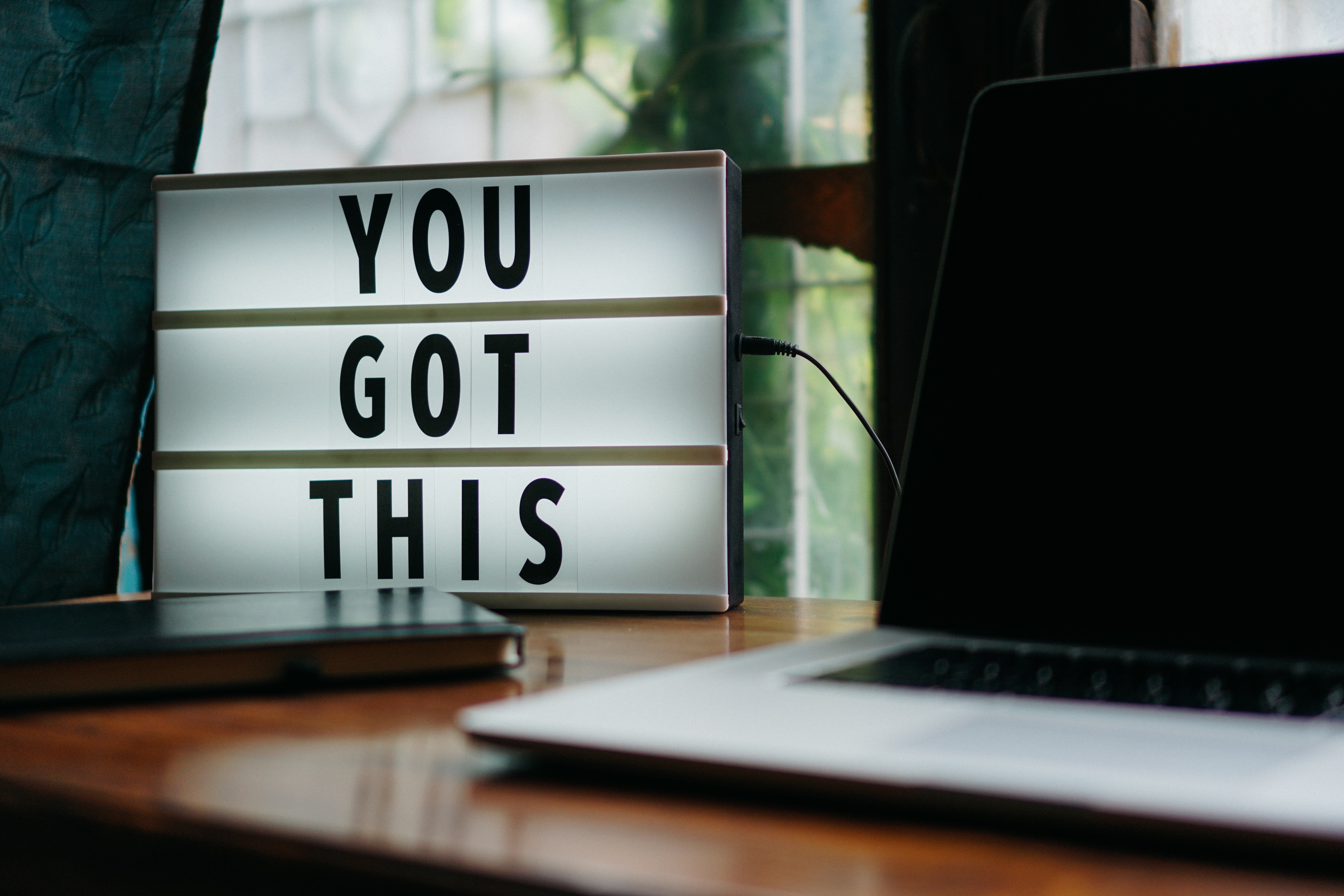 Image of a computer and a sign saying &quot;You Got This&quot;