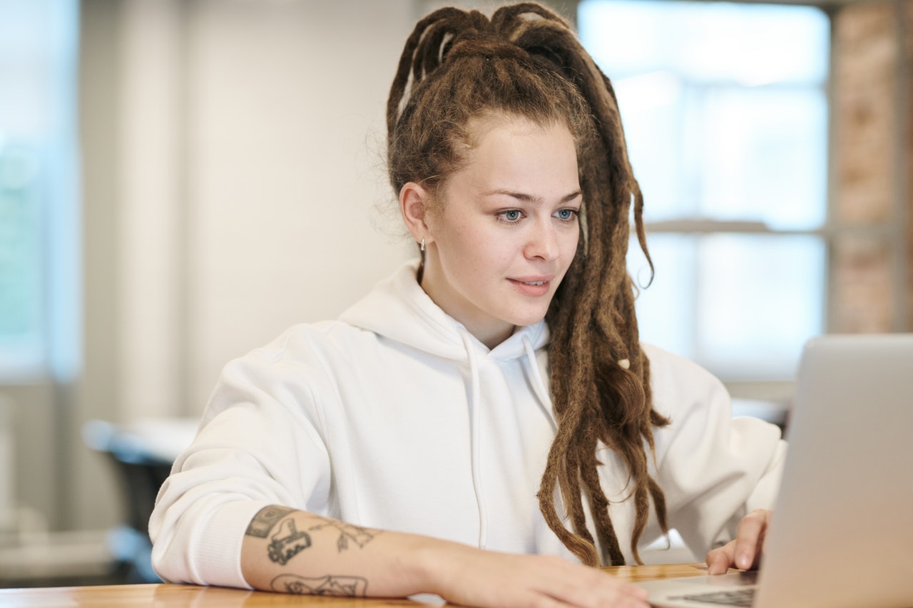 Lady with Dreadlocks on Laptop