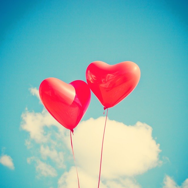 two balloons with a cloud