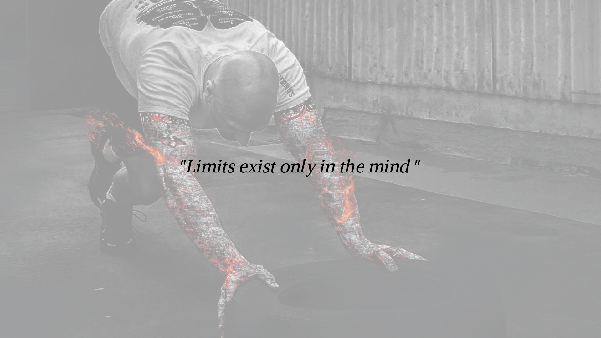 alt="banner that displays the inspirational fitness quote "limits exist only in the mind" while in the background a strong, fit man with his arm muscles on fire is training at the gym pushing a tire that is on the ground"