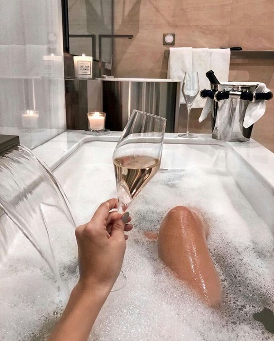 girl in bubble bath tub with glass of champagne relax office writing coffee tea lounge creating social media autopilot