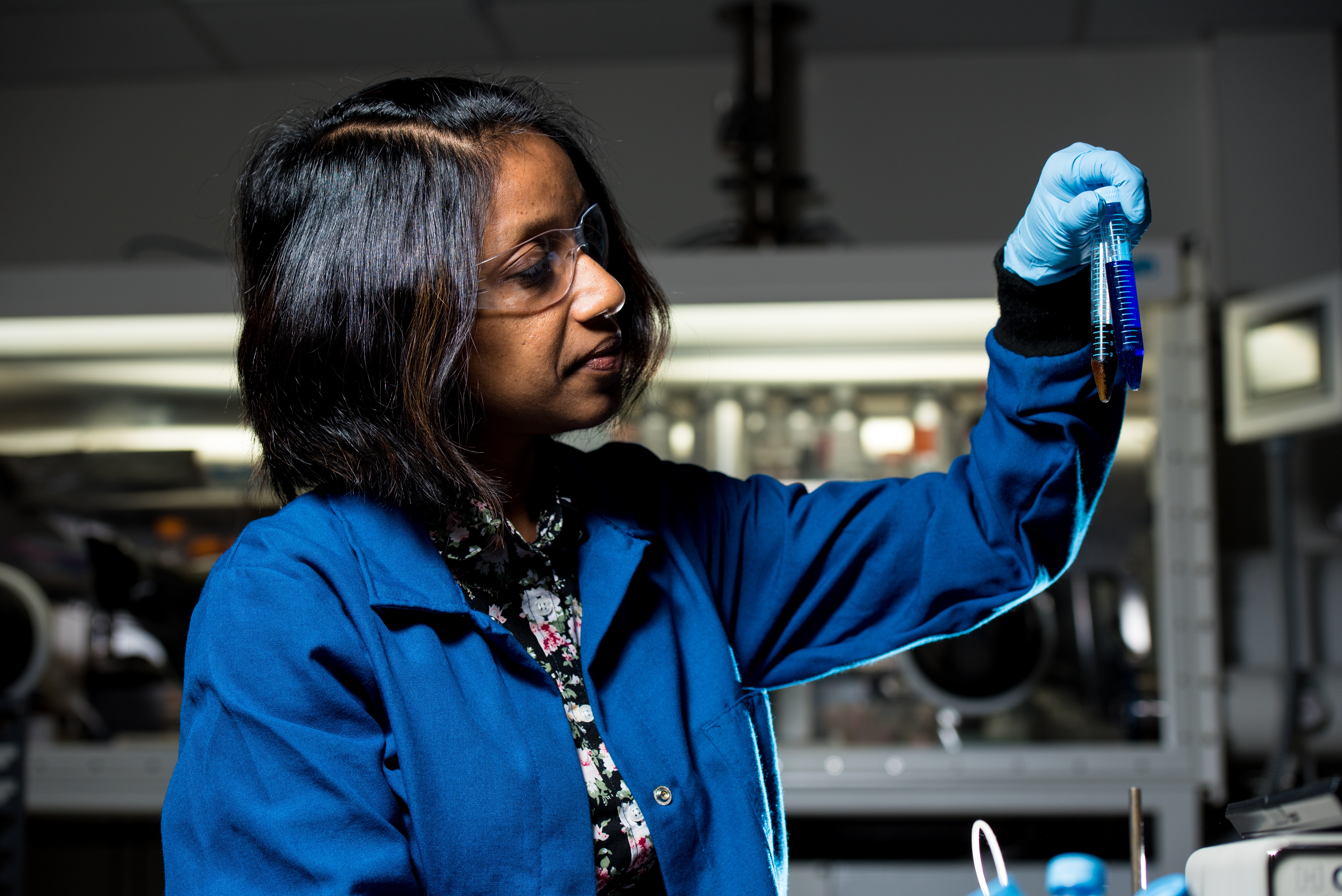 Woman scientist holding test tube