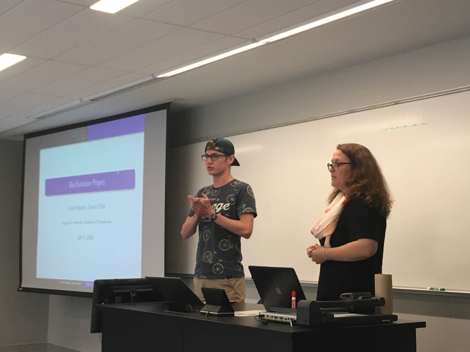 Carter and Grace talking about their work on a model for biological evolution