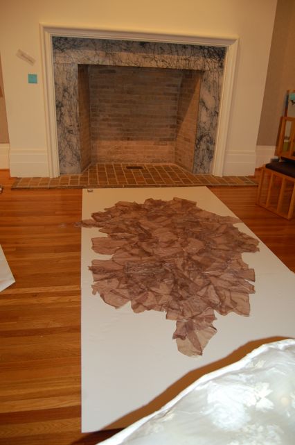 image: The piece was hung above the fire place.