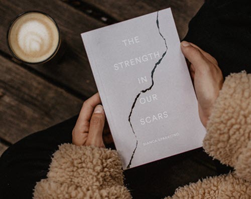 Book titled The Strength in our Scars