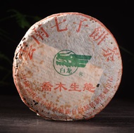 2003 White Dragon "Qiao Mu Sheng Tai" Jing Gu Raw Pu-erh from Yunnan Sourcing
