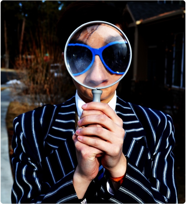 Man with magnifier image