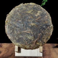 2000 Yi Wu "Huang Pian" Matured Leaves Raw Pu-erh Tea Cake from Yunnan Sourcing