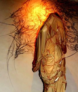 image: Drawing, hand-stitched adornment and photo created by artist, 2009.