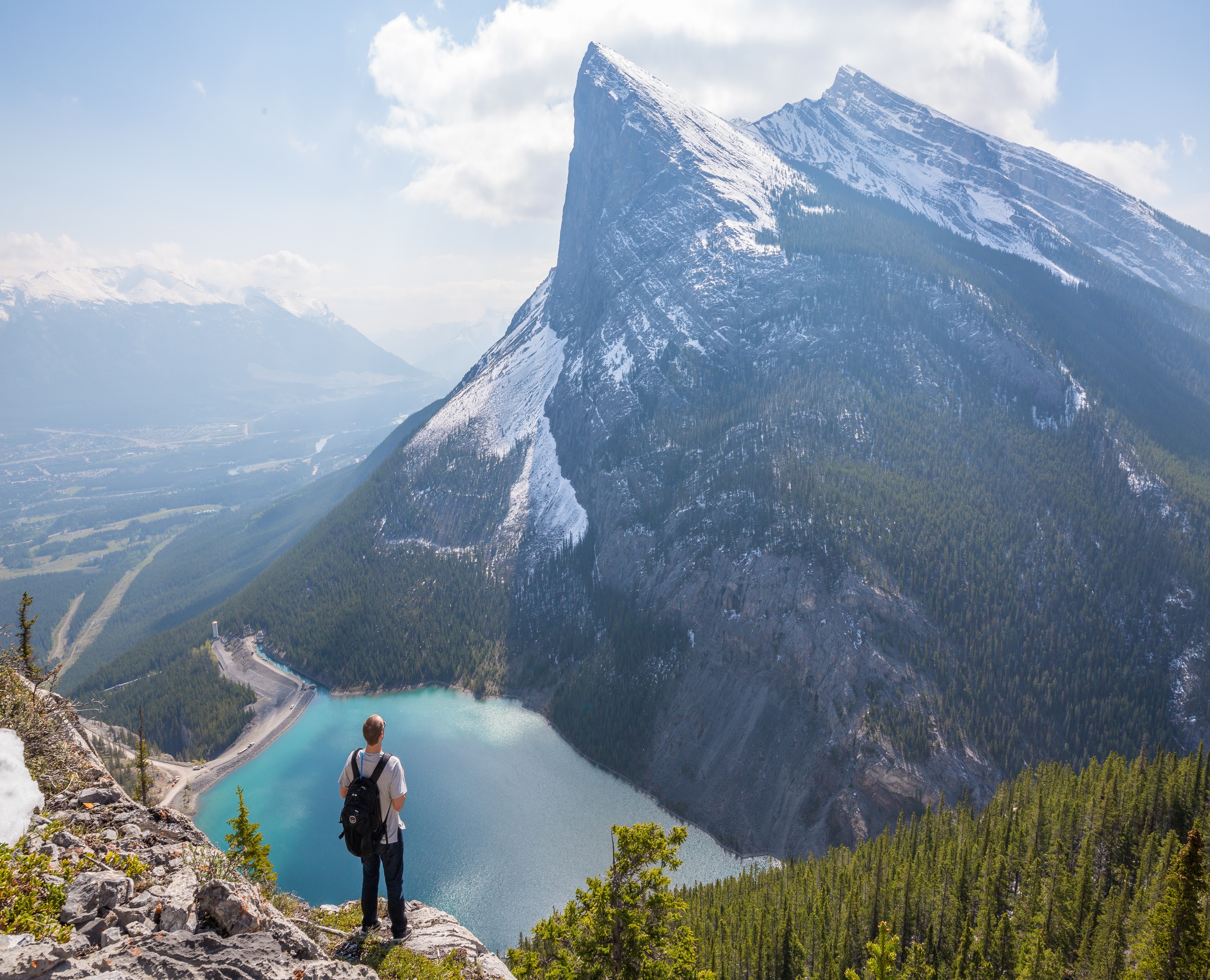 Man Overlooking Mountain and Lake