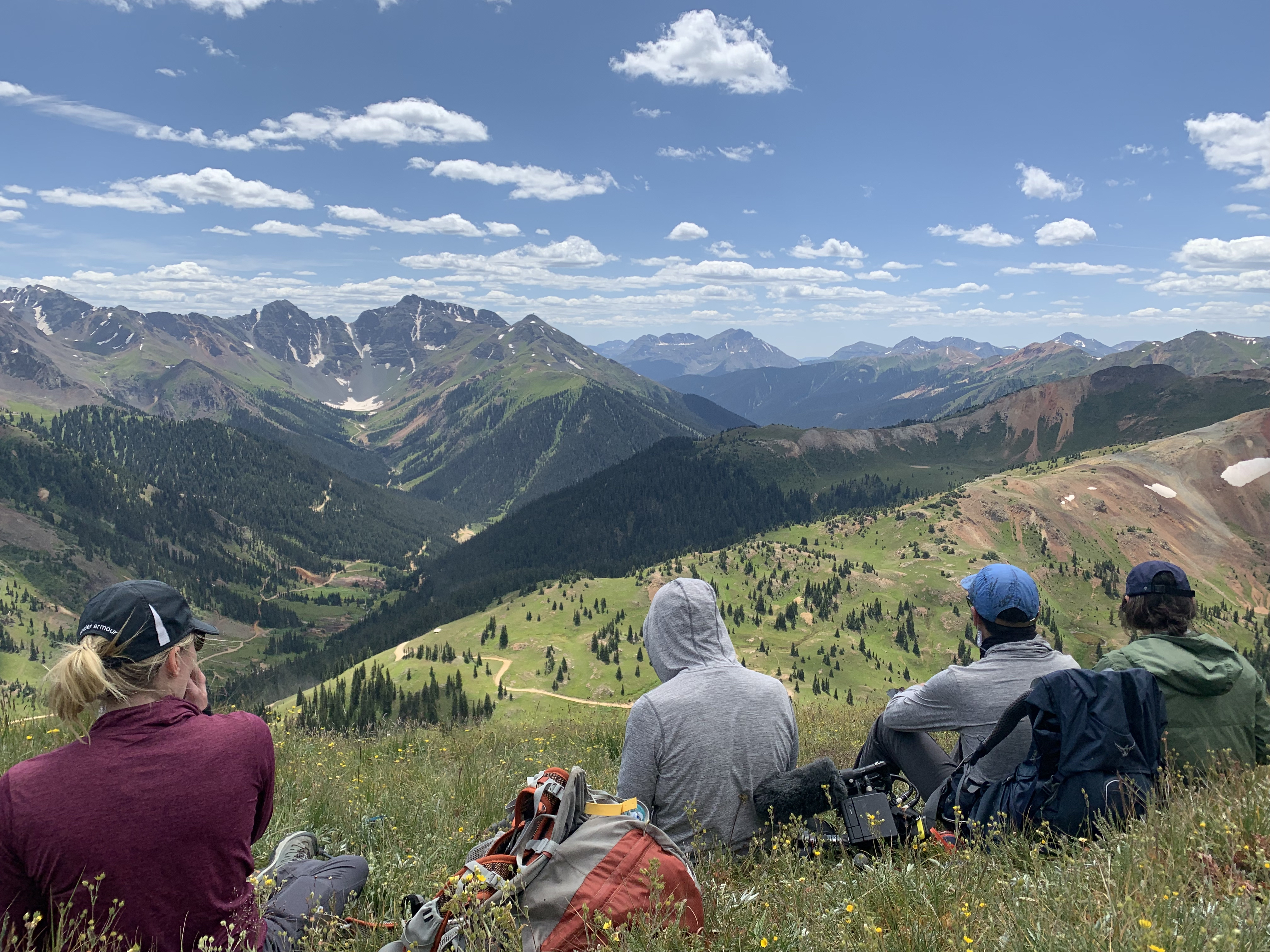 Students sitting on a mountain top