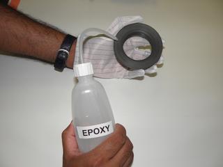 Apply epoxy to the mounting ring.