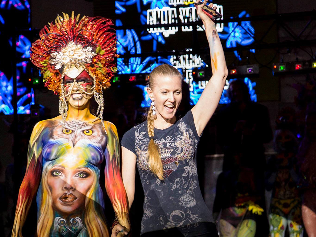 Anja Yamaji with her body-painted model at the Texas Bodypaint Competition 2016. Third-place winner. Model wearing a headdress created by Anja Yamaji.