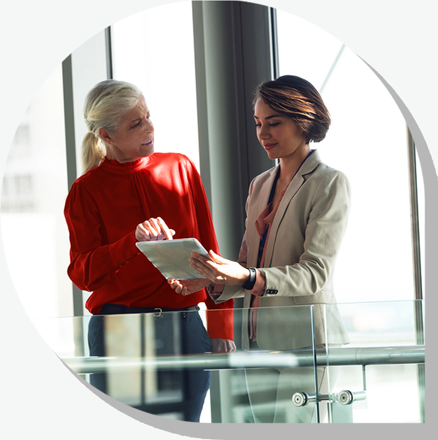 A boss and her employee discussing a corporate project