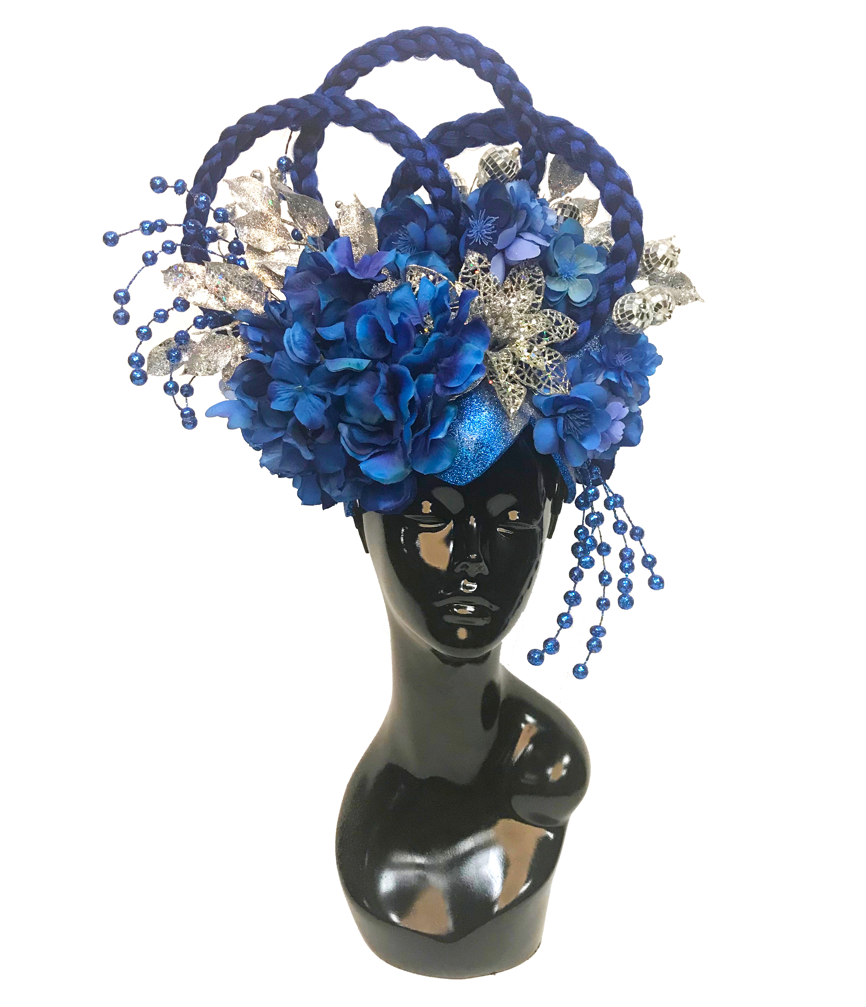 Blue and silver headdress made by Anja Yamaji, displayed on a mannequin head. This headdress showcases what can be created on top of a peacock style headdress base.