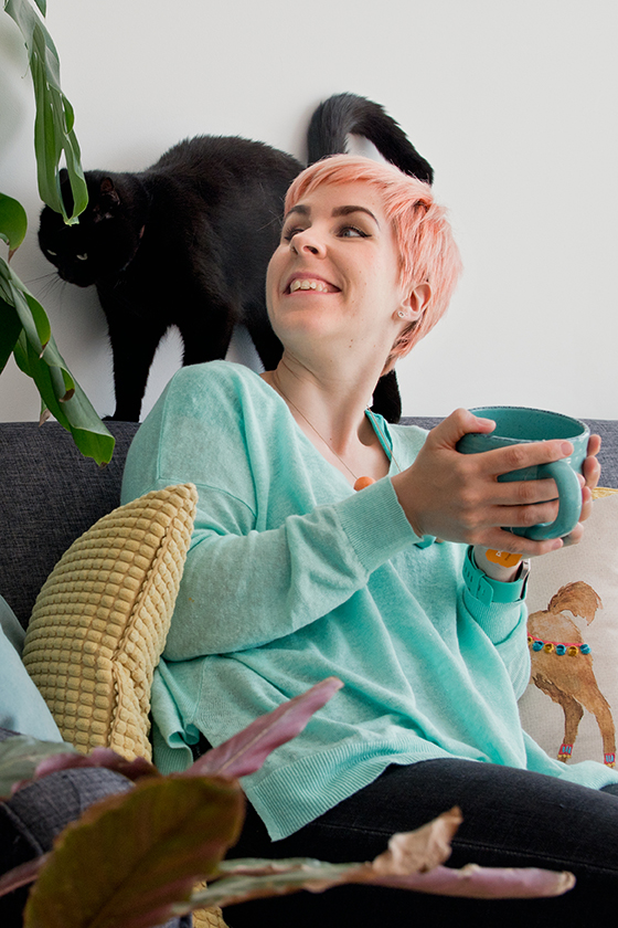Amy and her cat at home in Nottingham