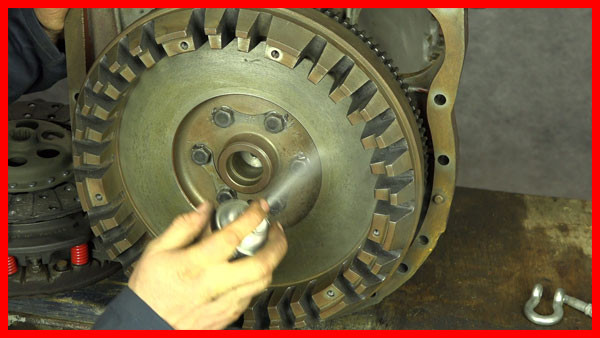 applying clutch and brake cleaner to flywheel