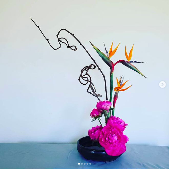 Bird of paradise flowers with kiwi vine and pink peonies, arranged in a Japanese Zen kado style by Mari Rose Taruc.