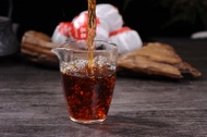 Jinggu "Da Hong Gan" Gong Ting Ripe Pu-erh Tea in Tangerine from Yunnan Sourcing