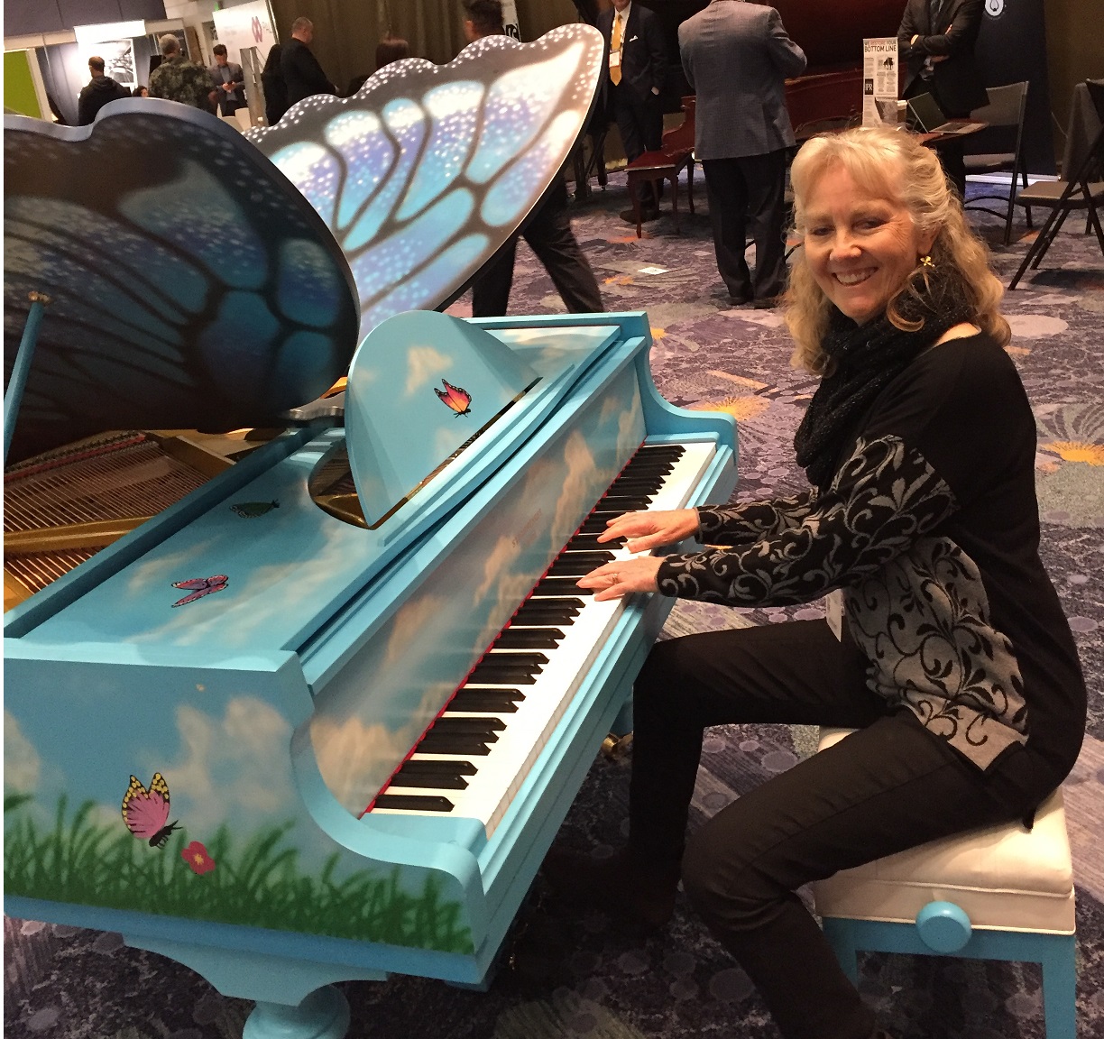 Playing a butterfly piano at NAMM