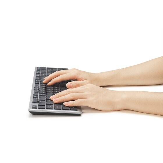 Hands typing on the Scissor-Switch Keyboard