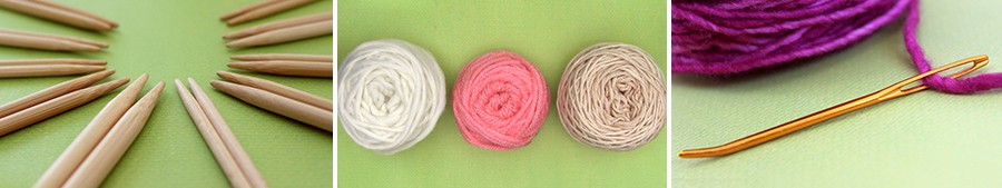 3 Balls of yarn in white, pink, and beige colors on a green background