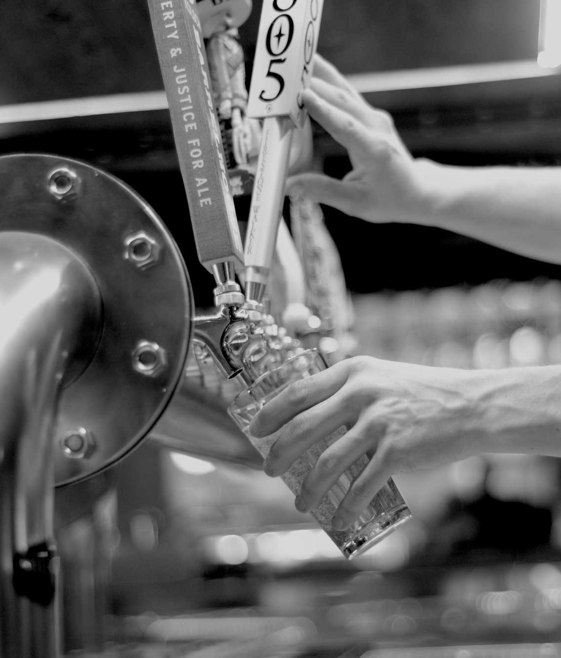 man pouring into glass